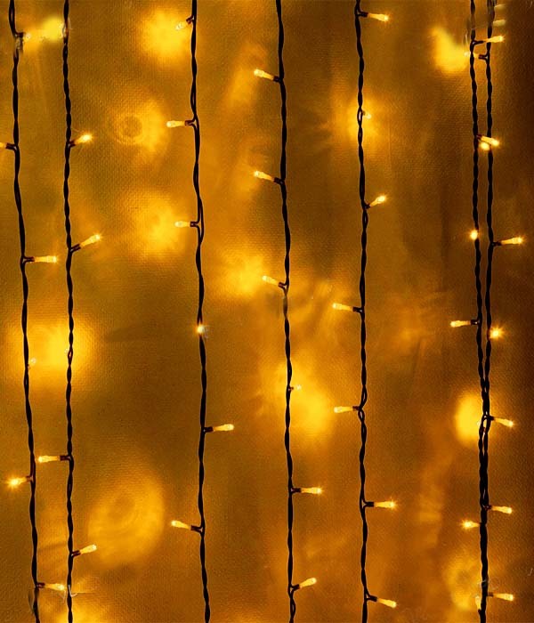 Качественная картинка Светодиодный занавес Laitcom, 2 x 3 м, 600 LED, IP54, прозр. провод, мерцание белого диода. желтый