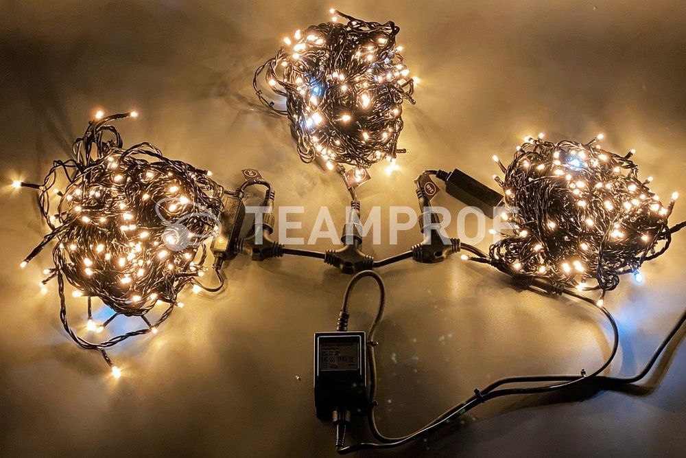 Светодиодная гирлянда спайдер Teamprof, 3 нити по 20м, мерцание, черный провод, теплая белая Качественная картинка Светодиодная гирлянда спайдер Teamprof, 3 нити по 20м, мерцание, черный провод, теплая белая