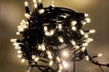 Качественная картинка Светодиодная гирлянда нить Teamprof, 10м, 100 LED, 24В, мерцание, черный провод РЕЗИНА, белая