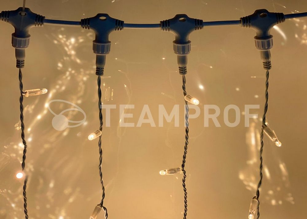 Светодиодный занавес Teamprof 2х6м, статика, черный провод, теплый белый Качественная картинка Светодиодный занавес Teamprof 2х6м, статика, черный провод, теплый белый